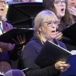 I Cantori di Carmel singers at a festive community sing-along.